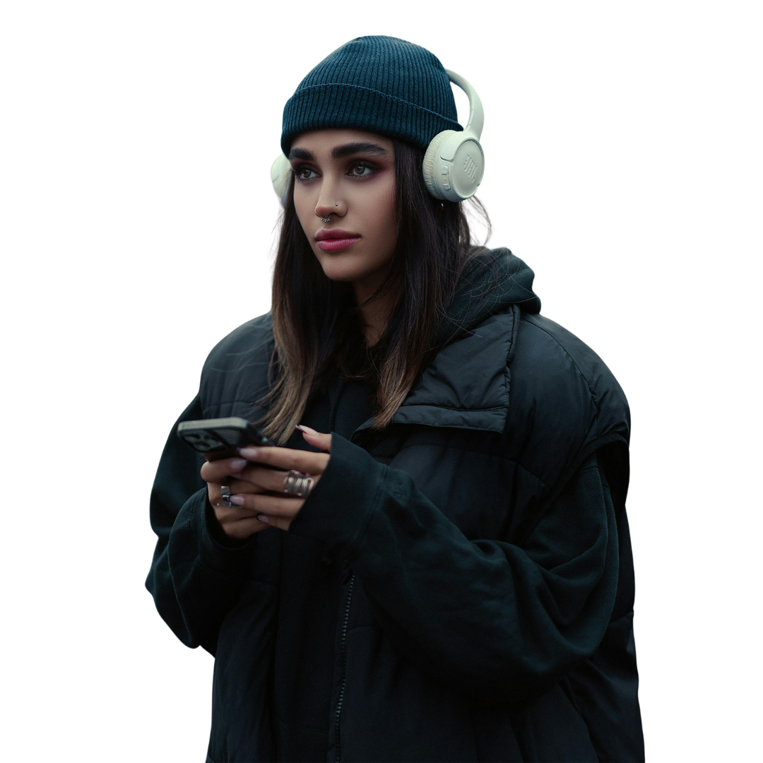 Woman wearing headphones and using a smartphone